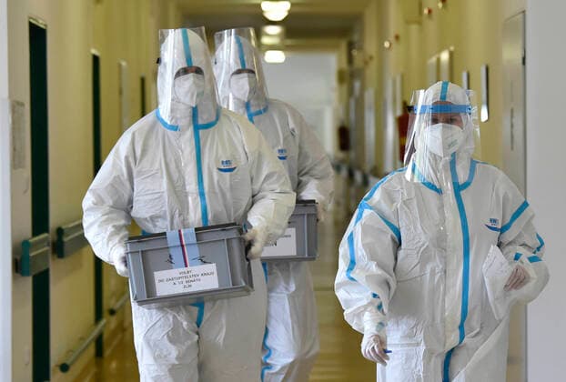 Election commission in protective clothing and reinforced by soldiers arrived at the Tomas Bata Regional Hospital in Zlin, Czech Republic, for votes in regional and Senate elections of patients suspected of having COVID-19. (CTKxPhoto DaliborxGluck) CTKPhotoP202010020361801 dg 007