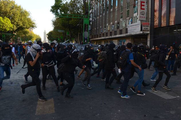 Mexico:52nd Anniversary of Massacre of Tlatelolco MEXICO CITY, MEXICO - OCTOBER 2: An Anarchist takes part during unrest to commemorate the 52th anniversary of the massacre of students in Tlatelolco. on October 2, 2020 in Mexico City, Mexico. On October 2, 1968 Students was killed while they were protesting against the Mexico s President Gustavo Diaz Ordaz at Plaza de las Tres Culturas **World Rights ** Mexico City Mexico Copyright: EyepixxGroup