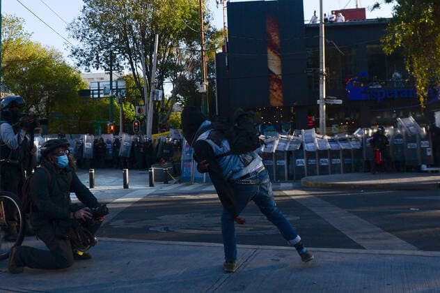 Mexico:52nd Anniversary of Massacre of Tlatelolco MEXICO CITY, MEXICO - OCTOBER 2: An Anarchist takes part during unrest to commemorate the 52th anniversary of the massacre of students in Tlatelolco. on October 2, 2020 in Mexico City, Mexico. On October 2, 1968 Students was killed while they were protesting against the Mexico s President Gustavo Diaz Ordaz at Plaza de las Tres Culturas **World Rights ** Mexico City Mexico Copyright: EyepixxGroup