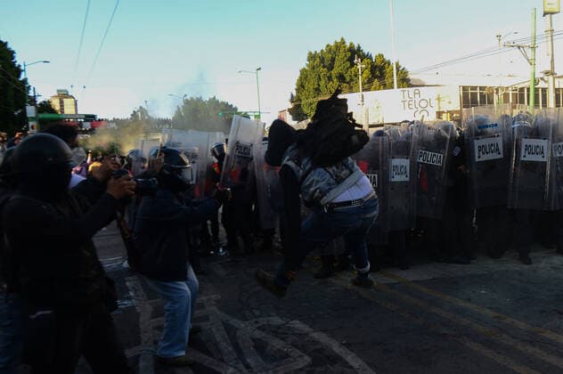 Mexico:52nd Anniversary of Massacre of Tlatelolco MEXICO CITY, MEXICO - OCTOBER 2: An Anarchist takes part during unrest to commemorate the 52th anniversary of the massacre of students in Tlatelolco. on October 2, 2020 in Mexico City, Mexico. On October 2, 1968 Students was killed while they were protesting against the Mexico s President Gustavo Diaz Ordaz at Plaza de las Tres Culturas **World Rights ** Mexico City Mexico Copyright: EyepixxGroup