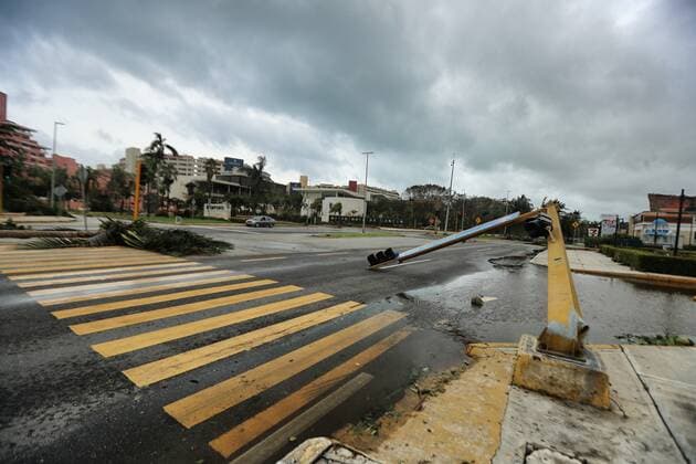 (201008) -- QUINTANA ROO, Oct. 8, 2020 -- Fallen traffic lights and trees are seen after Hurricane Delta hit Cancun, Quintana Roo state, Mexico, Oct. 7, 2020. Hurricane Delta weakened from a category 4 to a category 2 cyclone as it made landfall early Wednesday in the Mexican Caribbean state of Quintana Roo, but heavy rains and strong winds still caused some infrastructure damage, the National Meteorological Service (SMN) said. (Photo by Xinhua) MEXICO-QUINTANA ROO-HURRICANE DELTA MauricioxCollado 
