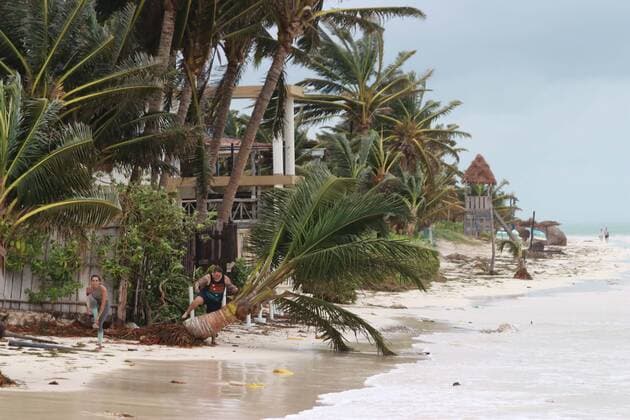 (201008) -- QUINTANA ROO, Oct. 8, 2020 -- People are seen on the beach after Hurricane Delta hit Puerto Morelos, Quintana Roo state, Mexico, Oct. 7, 2020. Hurricane Delta weakened from a category 4 to a category 2 cyclone as it made landfall early Wednesday in the Mexican Caribbean state of Quintana Roo, but heavy rains and strong winds still caused some infrastructure damage, the National Meteorological Service (SMN) said. (Photo by Xinhua) MEXICO-QUINTANA ROO-HURRICANE DELTA IsraelxRosas 
