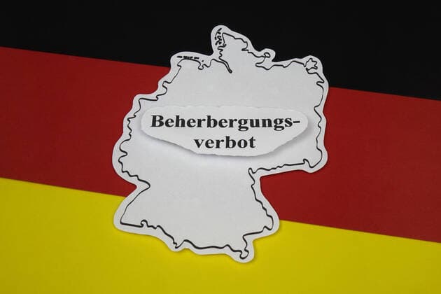 German flag and prohibition of accommodation German flag and prohibition of accommodation, 08 10 2020, Borkwalde, Brandenburg, Germany, On a German flag there is the writing prohibition of accommodation