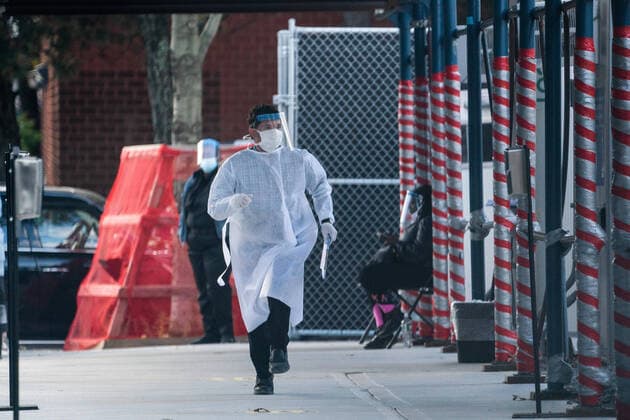 October 8, 2020, New York, New York, USA: A member of the medical staff runs through a NYC Department of Education (DOE) Priority COVID-19 testing site for teachers and students in the Brooklyn neighborhood of Borough Park on October 8, 2020 in New York. Borough Park is one of numerous Brooklyn neighborhoods that are witnessing a rising number of COVID-19 cases as New York City continues to trend down to around a one percent overall infection rate. New York City Mayor Bill de Blasio has announced plans to close nonessential businesses and schools in neighborhoods where positive COVID-19 rates have been higher than 3 percent. New York USA - ZUMAb148 20201008_zap_b148_015 Copyright: xBryanxSmithx
