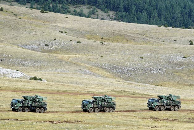 (201011) -- PESTER, Oct. 11, 2020 -- Serbian armored vehicles line up during a military exercise at the Pester plateau in southwestern Serbia on Oct. 10, 2020. The Serbian army held a large live-fire tactical exercise on Saturday with a focus on close air support. The exercise demonstrated a joint action of about 2,800 members of the Air Force, the Army, the 72nd Special Operations Brigade, and the 63rd Parachute Brigade, more than 150 combat and non-combat vehicles and combat systems, as well as about 40 aircraft. (Photo by Xinhua) SERBIA-PESTER-MILITARY-EXERCISE PredragxMilosavljevic 