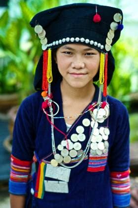 IMAGO Cultures of the world, Akha Volk in Laos August 7, 2013, Luang Prabang, Laos: Young girl wearing a Akha Nuqui traditional dress in Laos. Before it was worn everyday, and now is only for Festivals. It is common in the Phon Sali Province. Model Released: Model is Chanthala Yang Luang Prabang Laos - ZUMAc94_ 20130807_zap_c94_077 Copyright: xKikexCalvox