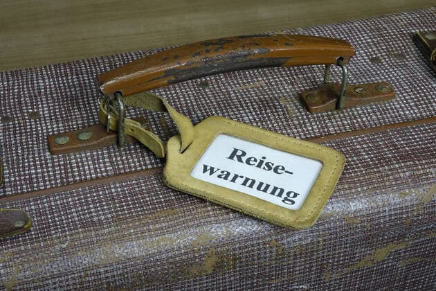 Suitcase with trailer Suitcase with trailer, 13 10 2020, Borkwalde, Brandenburg, In a luggage tag the word travel warning
