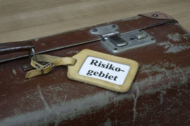 Suitcase with trailer Suitcase with trailer, 13 10 2020, Borkwalde, Brandenburg, In a luggage tag the word risk area is written