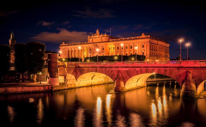 Sweden, Stockholm, view to Parliament Building with Norrbro Bridge in the foreground by night MPA000047