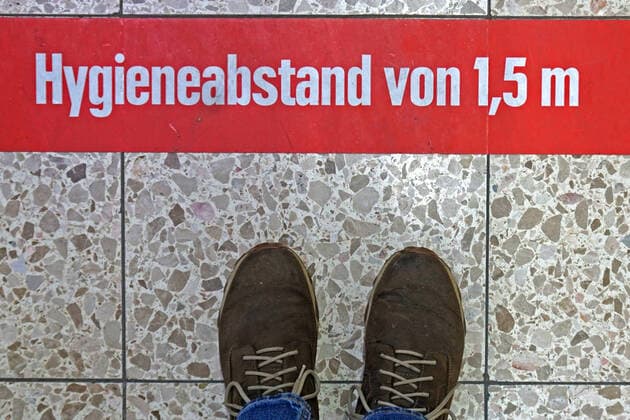 Restrictions due to the coronavirus As a measure to prevent infection with the coronavirus, customers in a supermarket are advised to observe the distance regulation on floors Essen Nordrhein Westfalen Germany