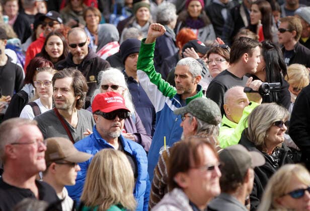 (201017) -- VANCOUVER, Oct. 17, 2020 -- Protesters without face masks attend an anti-restriction rally in Vancouver, British Columbia, Canada, on Oct. 17, 2020. Thousands of protesters took part in the anti-coronavirus-restriction rally to express their disapproval over a number of topics including lockdowns, mask mandates, quarantine, travel bans and social distancing. (Photo by Xinhua) CANADA-VANCOUVER-COVID-19-ANTI-RESTRICTION PROTEST LiangxSen 