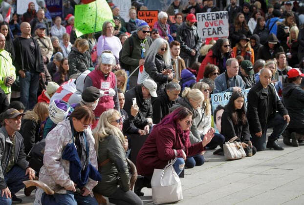 (201017) -- VANCOUVER, Oct. 17, 2020 -- Protesters without face masks attend an anti-restriction rally in Vancouver, British Columbia, Canada, on Oct. 17, 2020. Thousands of protesters took part in the anti-coronavirus-restriction rally to express their disapproval over a number of topics including lockdowns, mask mandates, quarantine, travel bans and social distancing. (Photo by Xinhua) CANADA-VANCOUVER-COVID-19-ANTI-RESTRICTION PROTEST LiangxSen 