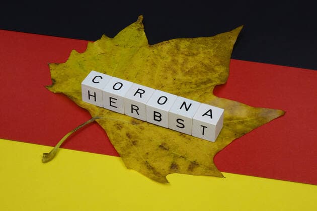 German flag and Corona Autumn German flag and Corona Autumn, 18 10 2020, Borkwalde, Brandenburg, Germany, On a German flag are letter cubes with the word Corona Autumn