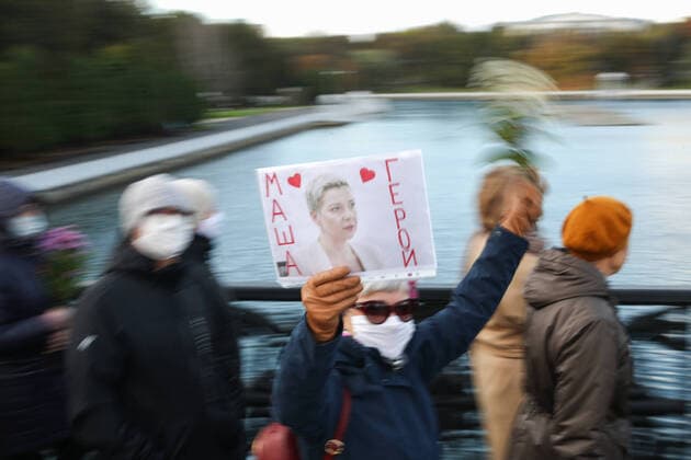MINSK, BELARUS - OCTOBER 19, 2020: An opposition supporter carries a photo of Mariya Kolesnikova, a representative of Viktor Barbarikoâ€™s presidential campaign, reading Masha is a Hero during the March of Seniors in central Minsk. Natalia Fedosenko TASS  TS0EB610