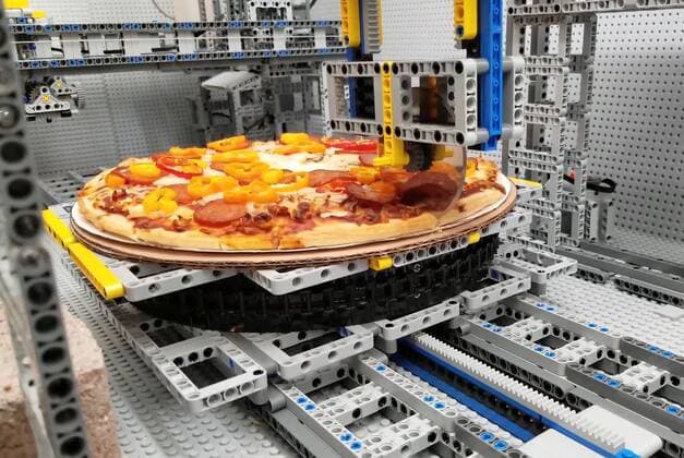 A Lego fan has built a jaw-dropping pizza-making machine entirely from Lego. Canada-based Iouri Petoukhov works with his son Michael to make amazing creations under the name The Brick Wall. Now they have celebrated five years of their projects with an intricate machine that serves up perfect pizzas. It includes mechanisms that dispense tomato sauce, grated cheese, sausage and peppers all while the pizza base revolves to allow even covering of toppings. Iouro tells Cover Images: We have family time when all speak out about what we called crazy ideas and then we write them down on paper and put it on our Brick wall. Making Pizza is an art and love, making Pizza wit Copyright: xx 40952502 EDITORIAL USE ONLY. NOT FOR USE BY NEWSPAPERS BASED IN THE UK.