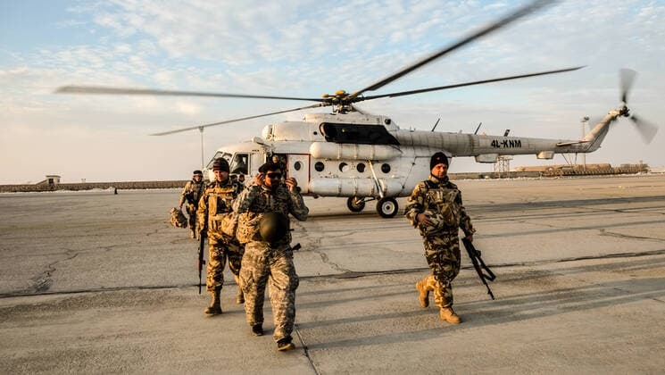 NATO soldiers leave the helicopter in Mazar e Sharif in Afghanistan on 26 November 2016 Bundeswehr soldiers form the Afghan army from Mazar e Sharif Afghanistan at several locations in the country