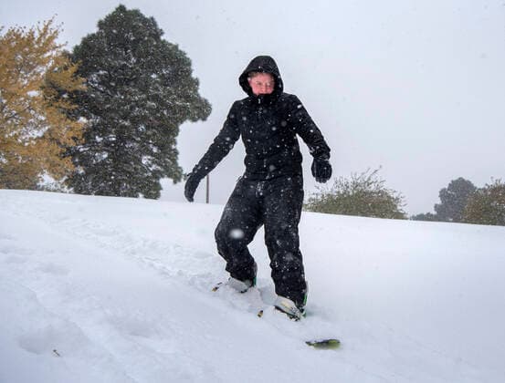October 26, 2020, USA: Joseph Harkey, 15, tries out a snowboard on a snow covered hill at Ashley Pond in Los Alamos Monday October 26, 2020. A winter storm dumped several inches of snow in the area. USA - ZUMAab1_ 20201026_zaf_ab1_004 Copyright: xEddiexMoorex