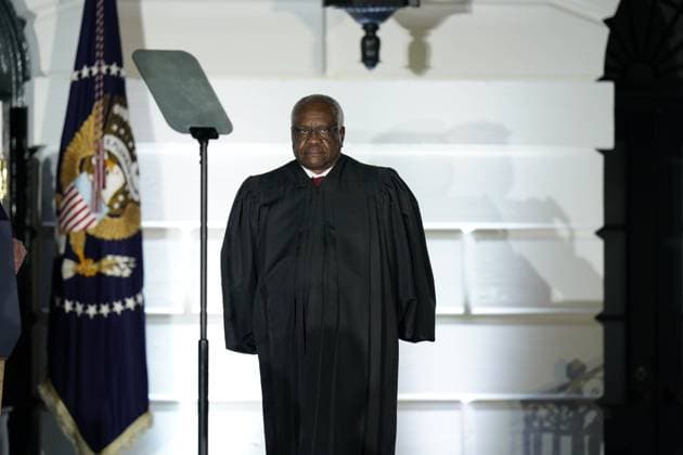 Associate Justice of the Supreme Court Clarence Thomas waits to administer the oath of office to Judge Amy Coney Barrett to be Associate Justice of the Supreme Court on the South Lawn of the White House in Washington, DC on Monday, October 26, 2020. US President Donald J. Trump and her husband Jesse M. Barrett look on. Copyright: xChrisxKleponisx xPoolxviaxCNPx MediaPunchx