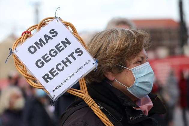 A woman with a sign Grandma against Right at a protest concert against the election of the new AfD faction leader on the Alter Markt at the Brandenburg Parliament in Potsdam, 27 October 2020 Protest concert Flügel statt Flügel in Potsdam
