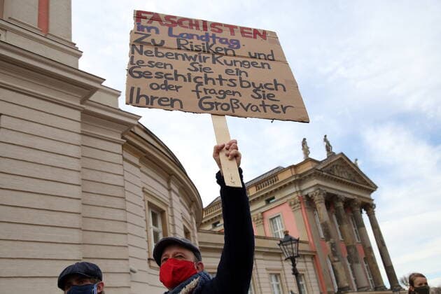 A man with a poster Fascists in the state parliament On risks and side effects read a history book or ask your grandfather at a protest concert against the election of the new AfD faction leader on the Alter Markt at the Brandenburg parliament in Potsdam, 27 October 2020 Protest concert Flügel statt Flügel in Potsdam
