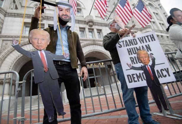 Protesters wearing masks of Crown Prince of Saudi Arabia.Mohammed bin Salman Russian (L) and Russian President Vladimir Putin hold marionette puppets of President Donald Trump as they participate in a demonstration sponsored by various humans rights groups protesting what they say is Trump s inappropriate relationships with autocrats and his manipulation of the Republican Party, at the Trump Tower in Washington, DC on Tuesday, October 27, 2020.  WAP202010273309 KEVINxDIETSCH