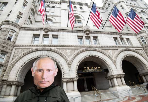 A protester wears a mask of Russian President Vladimir Putin as they participate in a demonstration sponsored by various humans rights groups protesting what they say is Trump s inappropriate relationships with autocrats and his manipulation of the Republican Party, at the Trump Tower in Washington, DC on Tuesday, October 27, 2020.  WAP202010273310 KEVINxDIETSCH