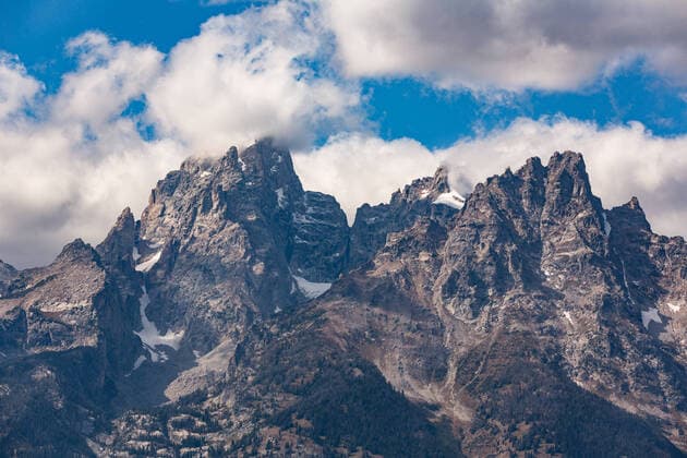 Clouds cover the summit of the Grand Teton in the Cathedral Group of the Teton Rangge in Grand Teton National Park in Wyoming, USA. Grand Teton National Park Wyoming United States Copyright: xJonxG.xFuller,xJr.x JGF-landscapes-Grand Teton NP-US-WY-4025