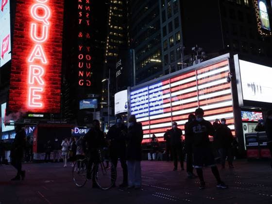 People watch as election results come on Election Night in Times Square in New York City on Tuesday, November 3, 2020. The 2020 Presidential Election is to be decided between candidates current President of the United States Donald Trump and former Vice President Joe Biden.  NYP20201103124 JohnxAngelillo