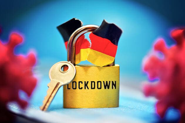 PHOTO MOUNTING, closed padlock with torn German flag and corona viruses, split of the company by the lockdown ** NUR FUER REDAKTIONELLE ZWECKE ** EDITORIAL USE ONLY **