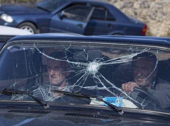 NAGORNO-KARABAKH - NOVEMBER 8, 2020: Refugees in a car on the Armenian border. The fighting between Armenia and Azerbaijan over the disputed Caucasus Mountains territory of Nagorno-Karabakh resumed in late September with both countries accusing each other of provocation, declaring martial law, and mobilizing their armed forces. Stanislav Krasilnikov TASS  TS0ED7DE