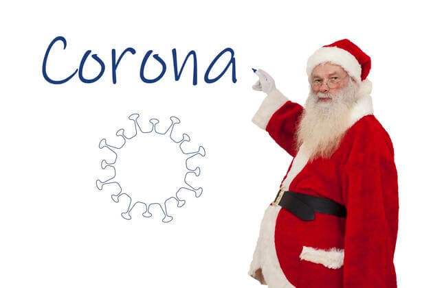 Santa Claus writes Corona on a wall