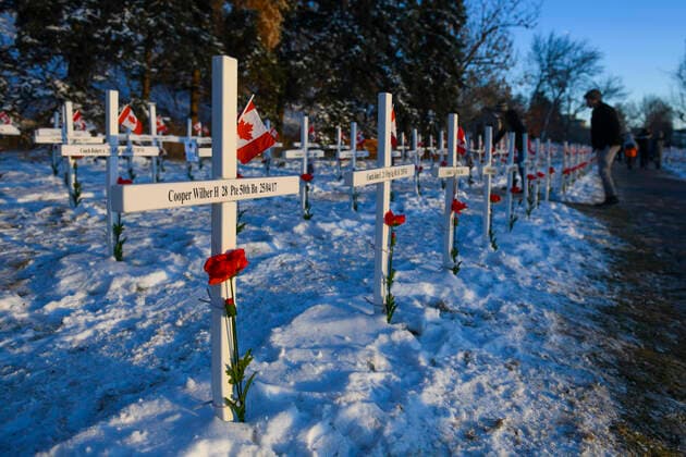 November 11, 2020, Calgary, Alberta, Canada: Members of the public walk through rows of crosses on Remembrance Day, November 11th, at the Field of Crosses memorial in Calgary, Alberta. The Field of Crosses is a yearly memorial that recognizes the nearly 120,000 Canadian veterans who lost their lives in wars since 1914. Calgary Canada - ZUMAj113 20201111_zip_j113_001 Copyright: xGavinxJohnx