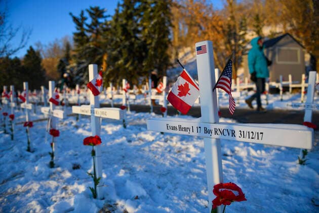 November 11, 2020, Calgary, Alberta, Canada: Members of the public walk through rows of crosses on Remembrance Day, November 11th, at the Field of Crosses memorial in Calgary, Alberta. The Field of Crosses is a yearly memorial that recognizes the nearly 120,000 Canadian veterans who lost their lives in wars since 1914.4. Calgary Canada - ZUMAj113 20201111_zip_j113_003 Copyright: xGavinxJohnx