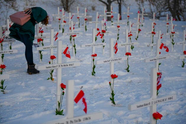 November 11, 2020, Calgary, Alberta, Canada: Members of the public inspect memorial crosses on Remembrance Day, November 11th, at the Field of Crosses memorial in Calgary, Alberta. The Field of Crosses is a yearly memorial that recognizes the nearly 120,000 Canadian veterans who lost their lives in wars since 1914. Calgary Canada - ZUMAj113 20201111_zip_j113_006 Copyright: xGavinxJohnx
