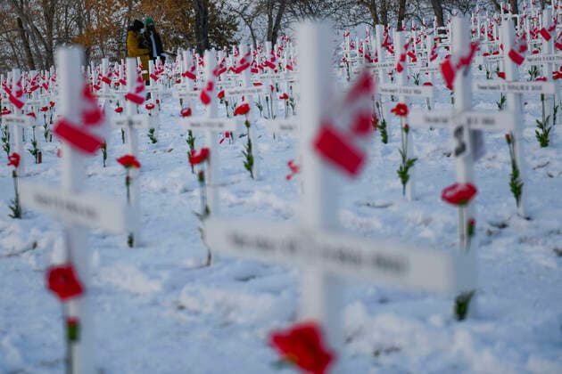 November 11, 2020, Calgary, Alberta, Canada: Members of the public walk through rows of crosses on Remembrance Day, November 11th, at the Field of Crosses memorial in Calgary, Alberta. The Field of Crosses is a yearly memorial that recognizes the nearly 120,000 Canadian veterans who lost their lives in wars since 1914. Calgary Canada - ZUMAj113 20201111_zip_j113_009 Copyright: xGavinxJohnx
