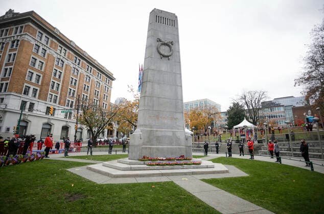 (201111) -- VANCOUVER, Nov. 11, 2020 -- Representatives of Canadian Armed Forces stand around the cenotaph with physical distance during the Remembrance Day ceremony at Victory Square in Vancouver, British Columbia, Canada, Nov. 11, 2020. Due to the COVID-19 pandemic, this year s Remembrance Day was held under health safety measures. The Victory Square was closed to the public and only allowed limited number of attendees to participate in the ceremony. (Photo by Xinhua) CANADA-VANCOUVER-COVID-19-REMEMBRANCE DAY LiangxSen 