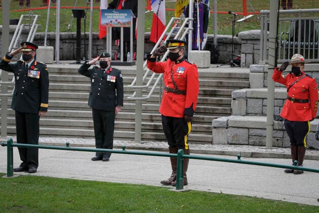 (201111) -- VANCOUVER, Nov. 11, 2020 -- Members of Canadian Armed Forces salute during the Remembrance Day ceremony at Victory Square in Vancouver, British Columbia, Canada, Nov. 11, 2020. Due to the COVID-19 pandemic, this year s Remembrance Day was held under health safety measures. The Victory Square was closed to the public and only allowed limited number of attendees to participate in the ceremony. (Photo by Xinhua) CANADA-VANCOUVER-COVID-19-REMEMBRANCE DAY LiangxSen 