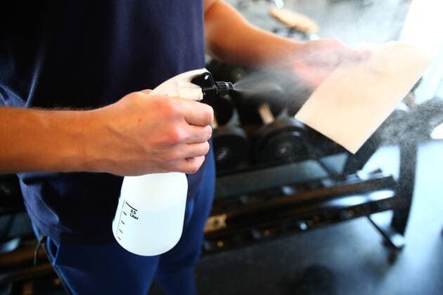 Diez fitness studios in the Corona time A man sprays disinfectant on a cloth to a fitness studio Fitness studios in the Corona time Copyright: xEibner-Pressefotox EP_RWS