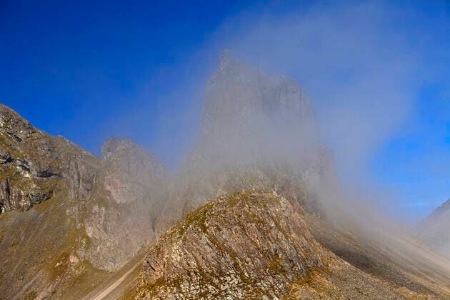 Mountain Eystrahorn with blue sky and a cloud of fog, Iceland, East Iceland, Krossanesfjall, Eystrahorn mountain Eystrahorn with blue sky and a cloud of fog, Iceland, East Iceland, Krossanesfjall, Eystrahorn BLWS632489 Copyright: xblickwinkel S.xZiesex