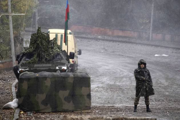 SHUSHI DISTRICT, AZERBAIJAN - NOVEMBER 18, 2020: A Russian peacekeeper at an outpost of the Azerbaijani Armed Forces and peacekeepers near the city of Shushi. The fighting between Armenia and Azerbaijan over the disputed Caucasus Mountains territory of Nagorno-Karabakh resumed in late September; on November 10, Armeniaâ€™s Prime Minister Nikol Pashinyan, Russiaâ€™s President Vladimir Putin, and Azerbaijanâ€™s President Ilham Aliyev signed a joint statement on a complete ceasefire in Nagorno-Karabakh. Stanislav Krasilnikov TASS  TS0EEAE5