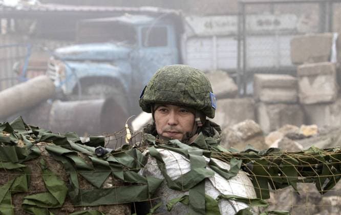 SHUSHA DISTRICT, AZERBAIJAN - NOVEMBER 22, 2020: A Russian peacekeeper stands guard outside the city of Shusha. On September 27, the fighting resumed over the disputed region of Nagorno-Karabakh. On November 9, the leaders of Armenia, Russia and Azerbaijan signed an agreement on a complete ceasefire and deployment of the Russian peacekeeping forces in Nagorno-Karabakh. On November 13, Russia s President Vladimir Putin signed a decree on establishing an interministerial body responsible for humanitarian operations in the region. Stanislav Krasilnikov TASS  TS0EF417