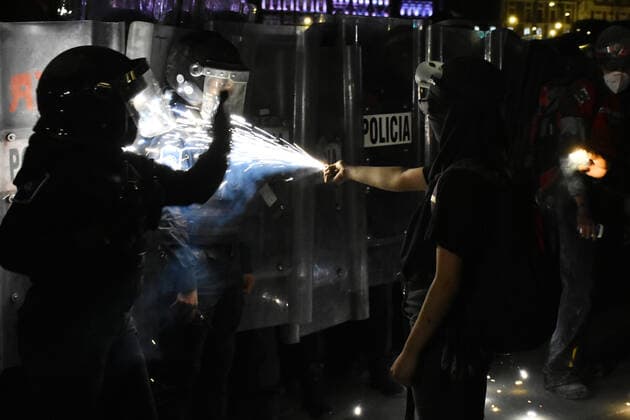 International Day for the Elimination of Violence against Women MEXICO CITY, MEXICO - NOVEMBER 25: A woman confronts a riot police line during the annual march of Day for the Elimination of Violence against Women to demand justice for the violence gender; Mexico is one of the countries with more violence against women, reaching 10 woman killed every day according to the UN. on November 25, 2020 in Mexico City, Mexico **World Rights ** Mexico City Mexico Copyright: RicardoxCastelanxCruz