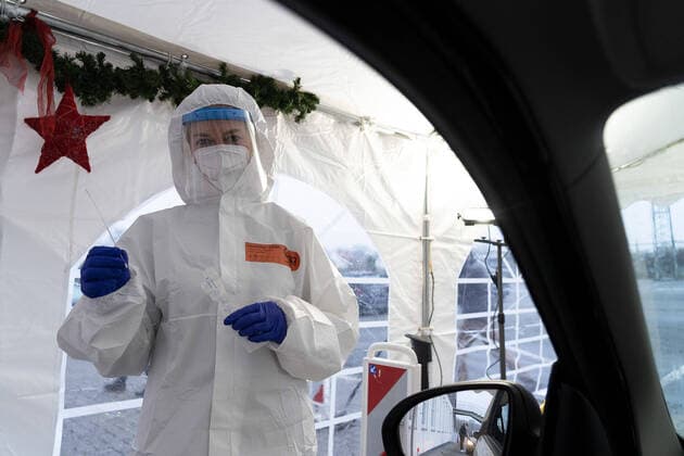 Osnabrueck, Germany 02 December 2020 First private corona test centre is presented at the Gartlage Osnabrueck hall A female employee in protective equipment holds a test stick in her hand Gartlage hall Lower Saxony Copyright: xFotostandx xHavergox