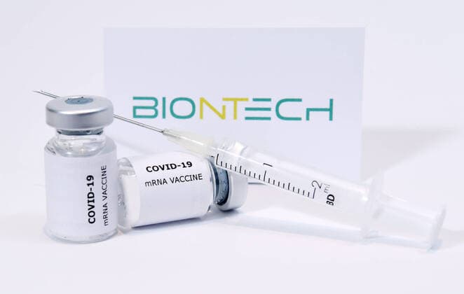 Tuebingen 03 12 2020 Symbol picture The corona vaccine of the biopharmaceutical company BioNTech has been approved in Great Britain Picture for editorial use only ULMER