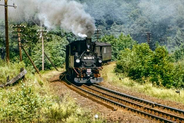 Schmalspurdampflok 99 1585-1 mit Personenzug auf dem Dreischienengleis bei Wolkenstein im Juli 1979,Sachsen,DDR,Deutschland,Europa *** Narrow gauge steam locomotive 99 1585 1 with passenger train on the three-rail track near Wolkenstein in July 1979,Saxony,GDR,Germany,Europe 1049002756