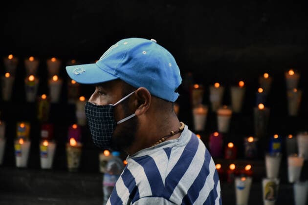 Mexico: Guadalupe Day Celebrations MEXICO CITY, MEXICO - DECEMBER 8: A Faithful lights a candle while visit the Basilica of Guadalupe church as part of pilgrimage to celebrates Guadalupe day, who celebrate on December 12 but as attempt to stop the spread of the new covid-19, the religious precinct will remain closed closed from December 10 to avoid crowds during the Guadalupe Day celebrations. On December 8, 2020 in Mexico City, Mexico **World Rights ** Mexico City Mexico Copyright: RicardoxCastelanxCruz