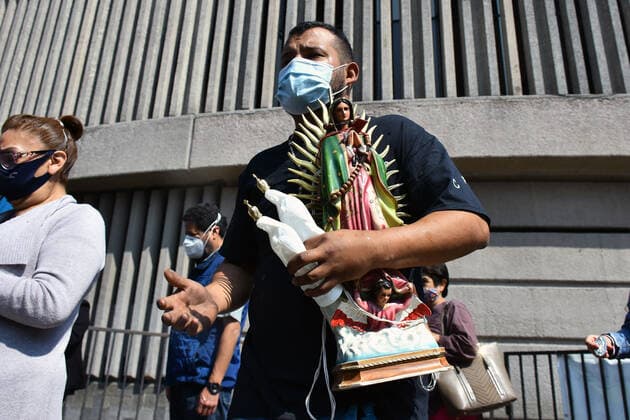 Mexico: Guadalupe Day Celebrations MEXICO CITY, MEXICO - DECEMBER 8: A Faithful holds a sculpture of Virgin of Guadalupe while visit the Basilica of Guadalupe church as part of pilgrimage to celebrates Guadalupe day, who celebrate on December 12 but as attempt to stop the spread of the new covid-19, the religious precinct will remain closed closed from December 10 to avoid crowds during the Guadalupe Day celebrations. On December 8, 2020 in Mexico City, Mexico **World Rights ** Mexico City Mexico Copyright: RicardoxCastelanxCruz