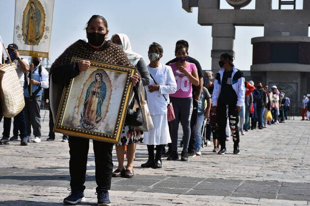 Mexico: Guadalupe Day Celebrations MEXICO CITY, MEXICO - DECEMBER 8: A Faithful holds a picture of the Virgin of Guadalupe while visit the Basilica of Guadalupe church as part of pilgrimage to celebrates Guadalupe day, who celebrate on December 12 but as attempt to stop the spread of the new covid-19, the religious precinct will remain closed closed from December 10 to avoid crowds during the Guadalupe Day celebrations. On December 8, 2020 in Mexico City, Mexico **World Rights ** Mexico City Mexico Copyright: RicardoxCastelanxCruz