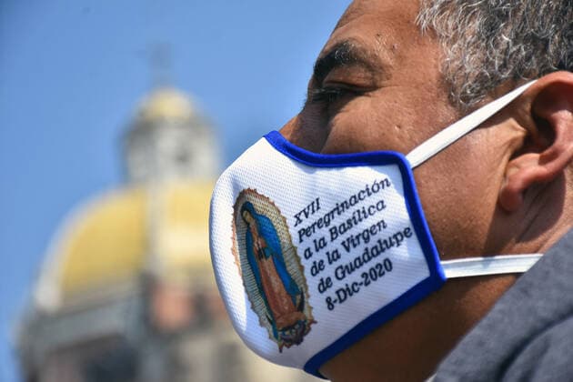 Mexico: Guadalupe Day Celebrations MEXICO CITY, MEXICO - DECEMBER 8: A Faithful wears a protective mask with the stamped picture of Virgin of Guadalupe while visit the Basilica of Guadalupe church as part of pilgrimage to celebrates Guadalupe day, who celebrate on December 12 but as attempt to stop the spread of the new covid-19, the religious precinct will remain closed closed from December 10 to avoid crowds during the Guadalupe Day celebrations. On December 8, 2020 in Mexico City, Mexico **World Rights ** Mexico City Mexico Copyright: RicardoxCastelanxCruz