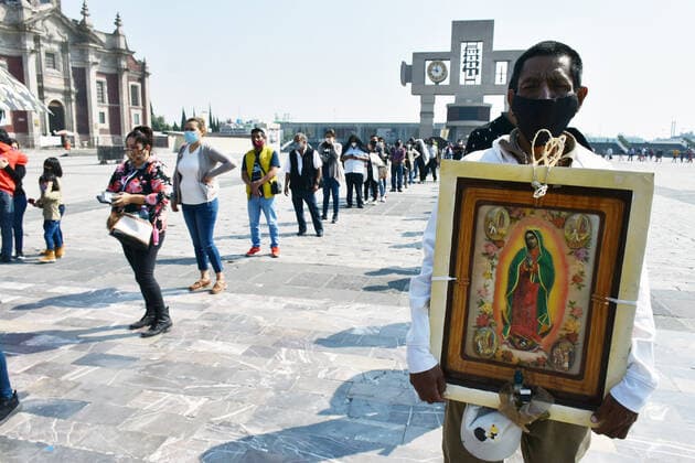 Mexico: Guadalupe Day Celebrations MEXICO CITY, MEXICO - DECEMBER 8: A Faithful holds a picture of the Virgin of Guadalupe while visit the Basilica of Guadalupe church as part of pilgrimage to celebrates Guadalupe day, who celebrate on December 12 but as attempt to stop the spread of the new covid-19, the religious precinct will remain closed closed from December 10 to avoid crowds during the Guadalupe Day celebrations. On December 8, 2020 in Mexico City, Mexico **World Rights ** Mexico City Mexico Copyright: RicardoxCastelanxCruz